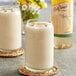 A close-up of two glasses of milkshakes with DaVinci Gourmet Banana Syrup in one.