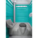 A PolyJohn portable restroom with a translucent top.