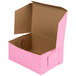 A 6 1/2" x 4" x 2 3/4" pink bakery box with a brown lid.