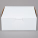 A white box with a white lid.