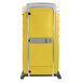A yellow plastic PolyJohn portable toilet.