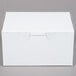 A white 5 1/2" x 4" x 3" bakery box with a lid.