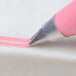 A close-up of a pink Ateco 2-hole piping tip.