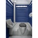 A PolyJohn dark blue portable restroom with a translucent top.