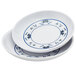 A white melamine sauce dish with a blue water lily design.
