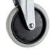 A black and white swivel caster with a metal attachment.