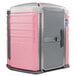 A pink PolyJohn wheelchair accessible portable toilet with a grey door.