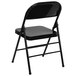 A black metal folding chair with a black backrest.