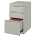 A white file cabinet with red file folders.