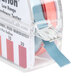 A package of Hydrion Water Hardness test strips with a blue strip of paper on a plastic container.