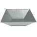 A silver triangular metal bowl with a textured finish.
