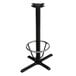 A black metal Lancaster Table & Seating bar height table base with a round metal foot ring.