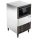 A silver and black Manitowoc undercounter ice machine with a stainless steel body.
