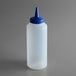 A clear plastic Vollrath squeeze bottle with a blue lid.