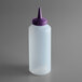 A clear plastic squeeze bottle with a purple lid.