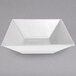 A white square G.E.T. Enterprises resin-coated aluminum bowl.