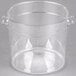 A Carlisle clear plastic food storage container with handles.