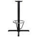 A Lancaster Table & Seating black cast iron bar height table base with a metal ring.