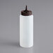 A white plastic Vollrath squeeze bottle with a brown cap with a single tip.
