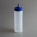 A clear plastic Vollrath squeeze bottle with a blue tip.