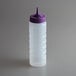 A clear plastic Vollrath squeeze bottle with a purple lid.