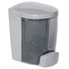 A grey PolyJohn liquid soap dispenser with a clear plastic lid.