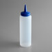 A clear plastic Vollrath squeeze bottle with a blue lid.