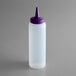 A white plastic squeeze bottle with a purple lid.