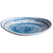 An Elite Global Solutions navy blue and white oval melamine plate with a swirl pattern.