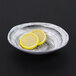 An Elite Global Solutions Van Gogh black melamine oval bowl with lemon slices in it.