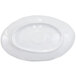 An oval black melamine plate with a white background.