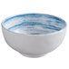 A white melamine bowl with a blue and white speckled design.