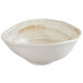 A white oval melamine bowl with brown specks on the rim.