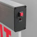 The white box for a Lavex LED red exit sign with a close up of a switch.