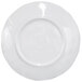 A white round melamine plate with a wavy navy rim.