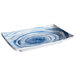 An Elite Global Solutions rectangular melamine plate with blue and white swirls on it.
