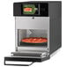 A pizza cooking in an ACP XpressChef 3i high-speed countertop oven.