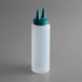 A white plastic squeeze bottle with a green Vista Green cap.