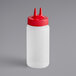 A Vollrath plastic squeeze bottle with a red Twin Tip cap.
