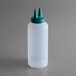 A white Vollrath Twin Tip squeeze bottle with a green plastic cap.