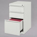 A white Hirsh Industries mobile pedestal file cabinet with 2 box drawers and 1 file drawer.