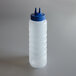 A white plastic squeeze bottle with a blue Twin Tip lid.
