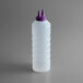 A clear plastic Vollrath squeeze bottle with a purple Twin Tip cap.