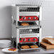 An Avantco commercial conveyor toaster with bread slices on a rack.