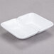 A white square GET Water Lily melamine dish with two compartments.
