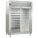 A Traulsen stainless steel reach-in refrigerator with narrow sliding glass doors.
