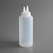A white plastic Vollrath squeeze bottle with two pointy tops.