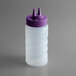 A plastic bottle with a purple Twin Tip lid.