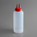 A white Vollrath Traex Twin Tip squeeze bottle with a red lid.