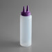 A white plastic squeeze bottle with a purple Twin Tip cap.